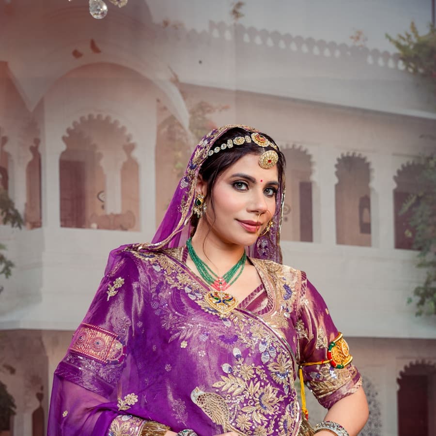 Woman in ornate purple traditional attire with jewellery