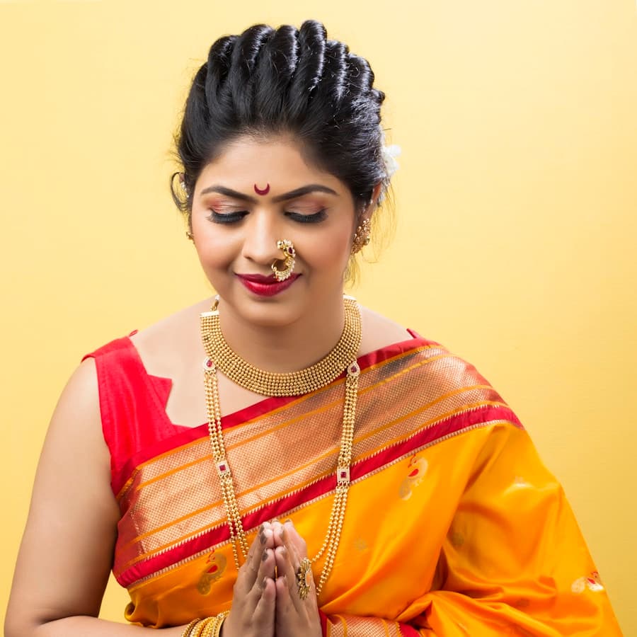 Woman in a yellow and red sari