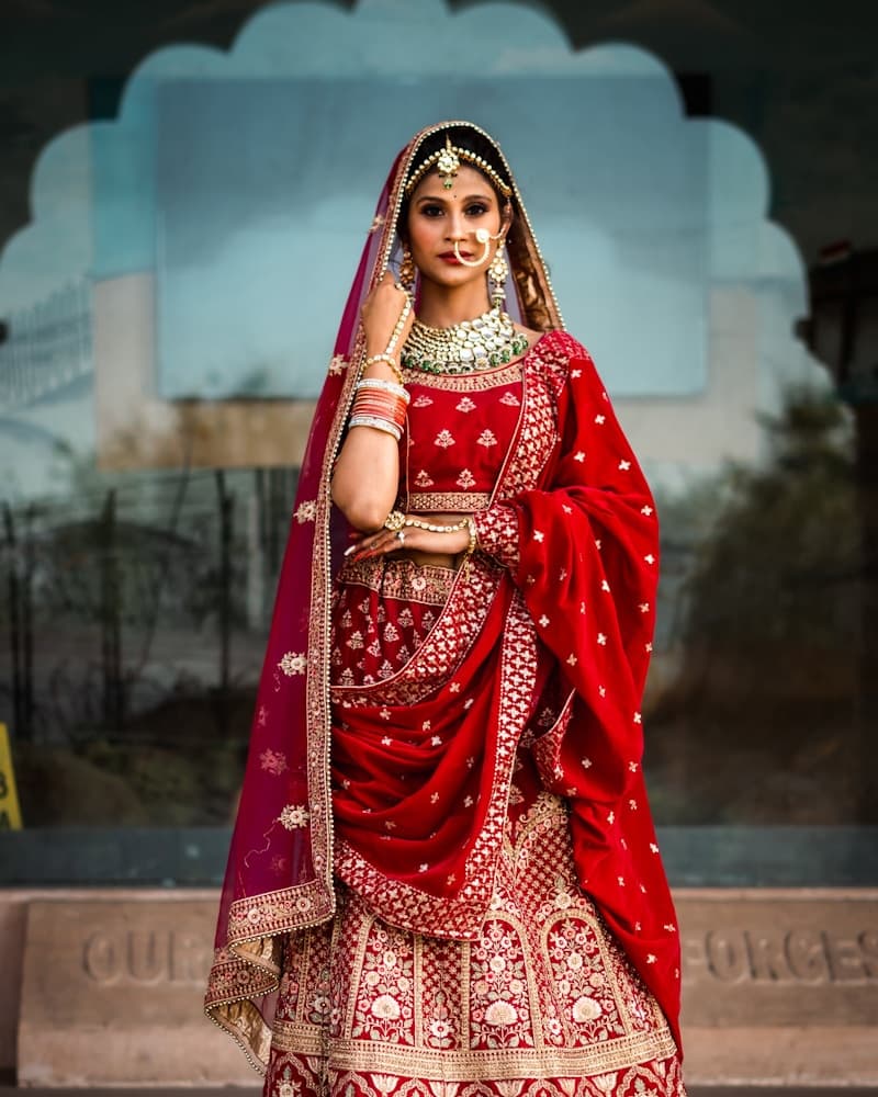 Woman in an ivory Chanderi suit set, smiling, full drape