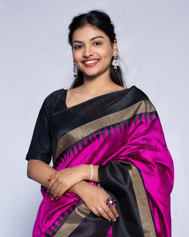 Woman in an ivory Chanderi suit set, smiling